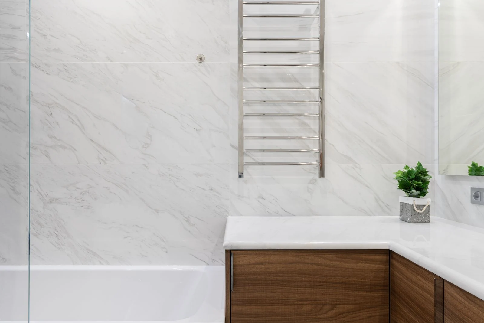 Wood vanity beneath a bathroom basin